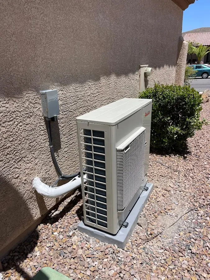 Residential air conditioning condenser unit in Washington Terrace